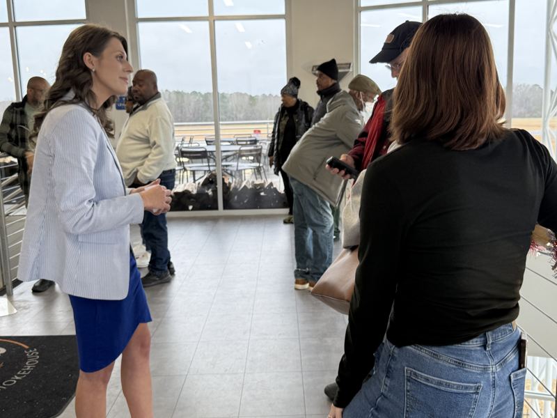 Caitlin meeting residents at a community gathering